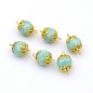 Lot de 6 perles rondes à facette nacrées - turquoise Lot de 6 perles rondes à facette nacrées - turquoise
