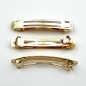 50 barrettes "Clip Paris" 8cmx1.1cm, monture doré 50 barrettes "Clip Paris" 8cmx1.1cm, monture doré