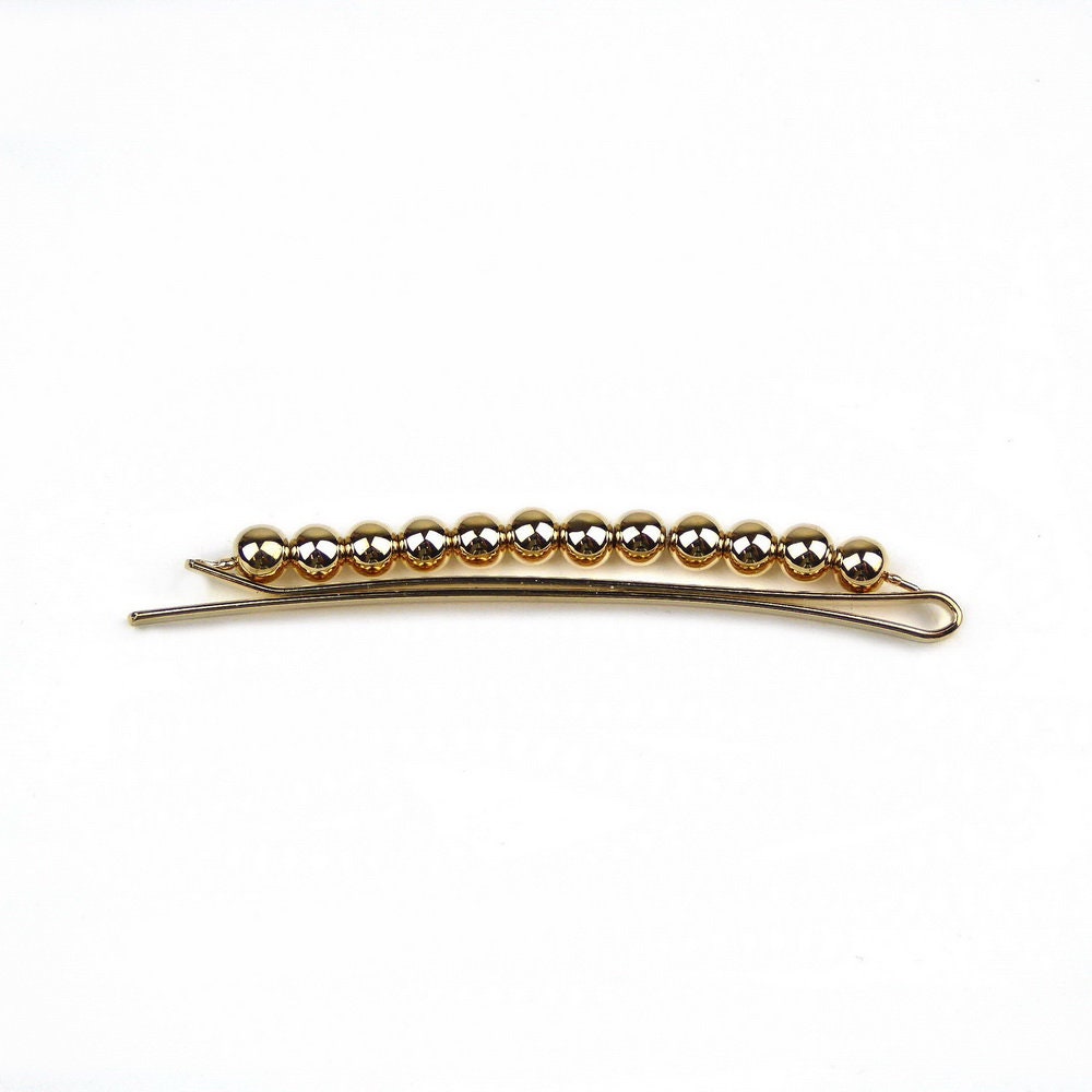 Pince cheveux fine avec boules doré 6.5cm