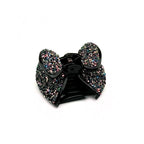 Pince à cheveux forme noeud et paillettes 4cm