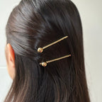 Pince cheveux avec boule en métal doré