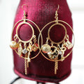 Grande boucle d'oreille pendante avec breloques