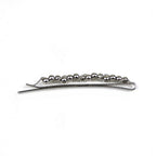 Pince à cheveux fine motif torsadé et perles argentées
