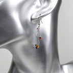 Boucle d'oreille pendante cristal