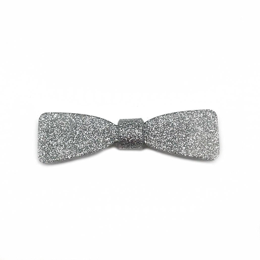Barrette cheveux acetate incrustée de paillette argenté en forme de nœud