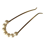 Élégant pic à chignon orné de perles délicates, mariage
