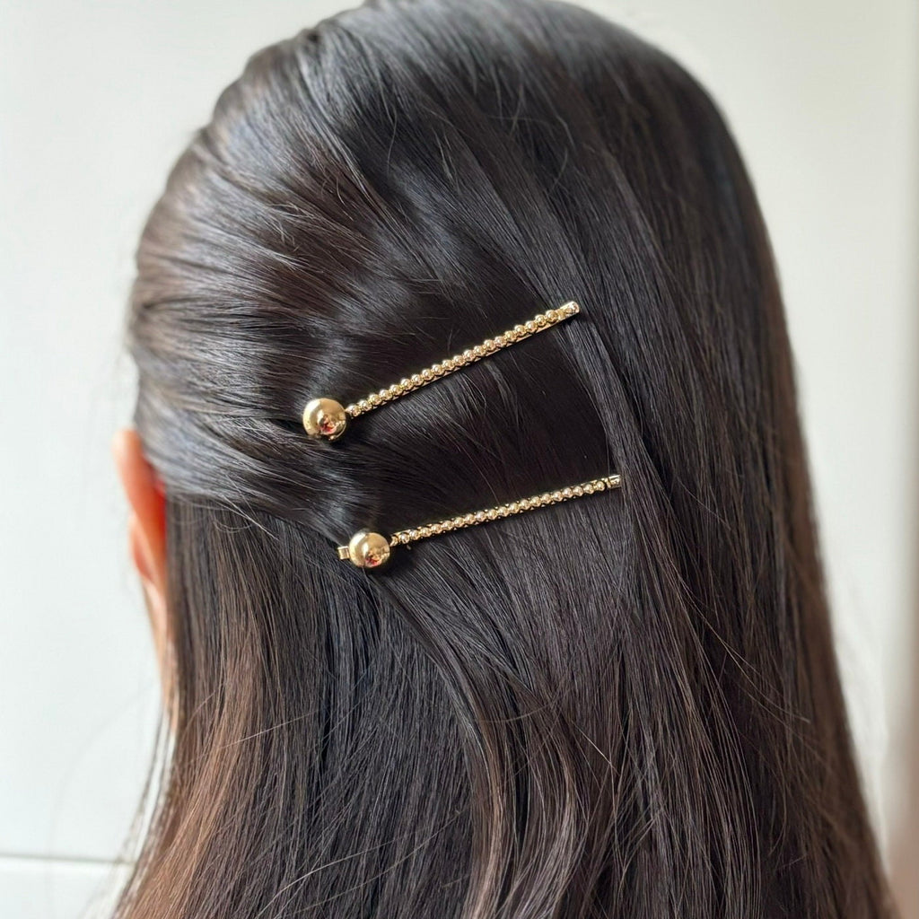 Pince cheveux avec boule en métal doré