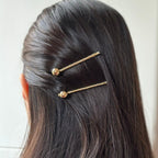 Pince cheveux avec boule en métal doré
