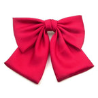 barrette cheveux ornée d'un nœud à pan en satin rouge