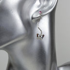 Boucle d'oreille pendant papillon cristal