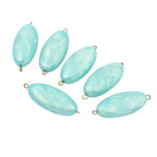 Lot de 10 perles ovales plates nacrées turquoise  en acrylique avec tige dorée